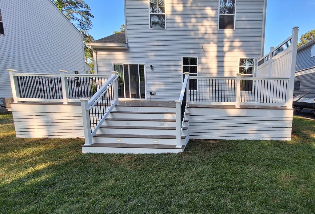 deck makeover using TimberTech decking with a privacy panel and lighting package 