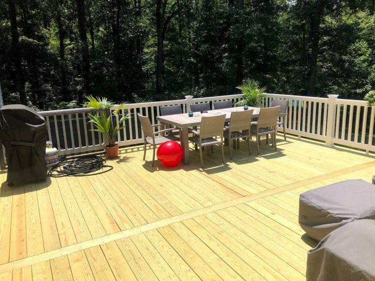 Pressure Treated Wood Deck with Breaker Board and White Washington Vinyl Railing