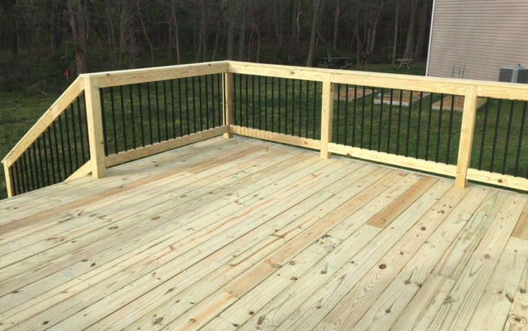 Pressure Treated Wood deck with black aluminum baluster railing