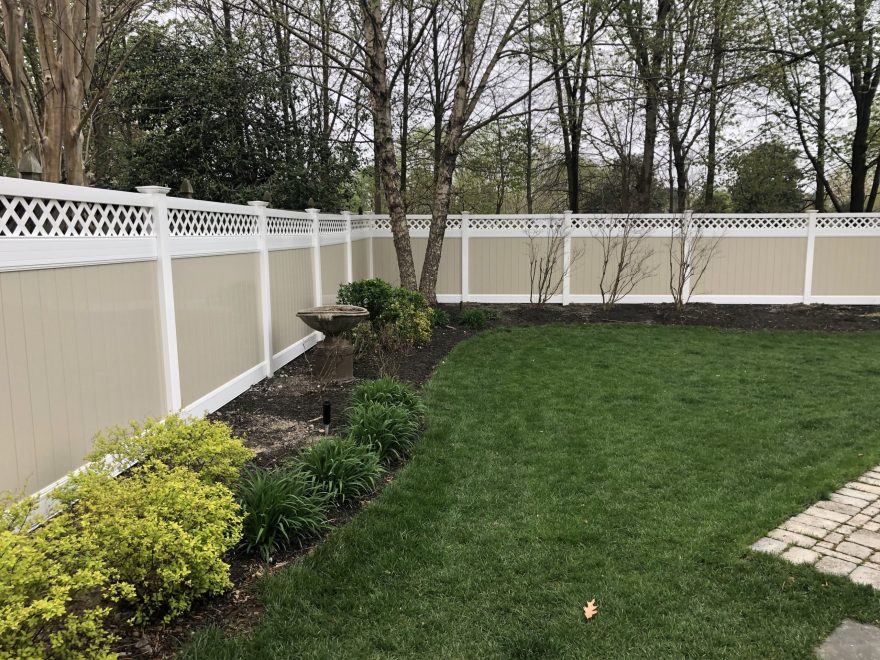 6 Two toned tan and white vinyl privacy fence with lattice top