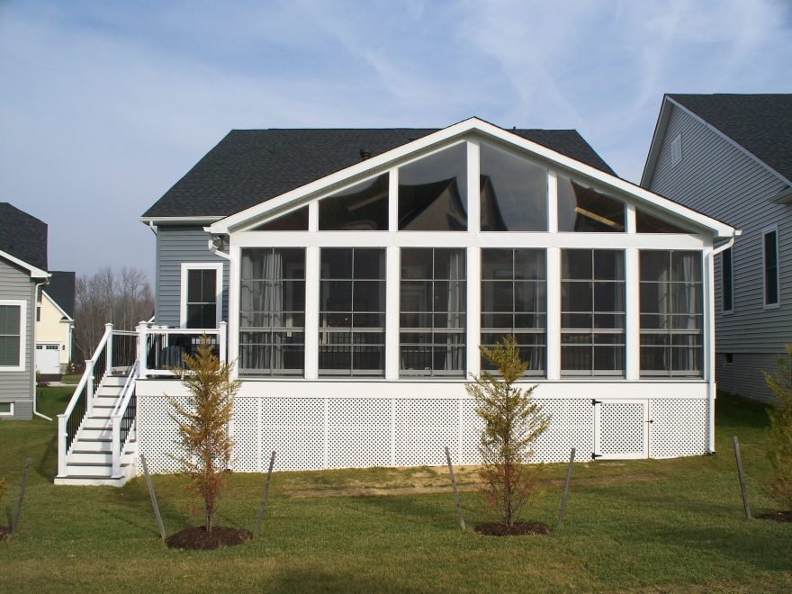 A photo of the finished screened room from the back of the house