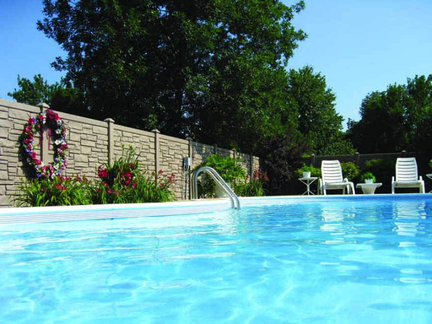 Brown Granite Simtek Fence surround a pool