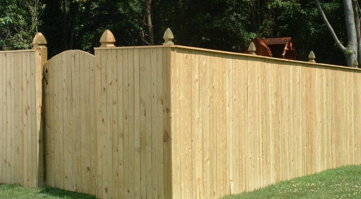 Pressure Treated Vertical Board Privacy Fence with French Gothic Posts and cap board