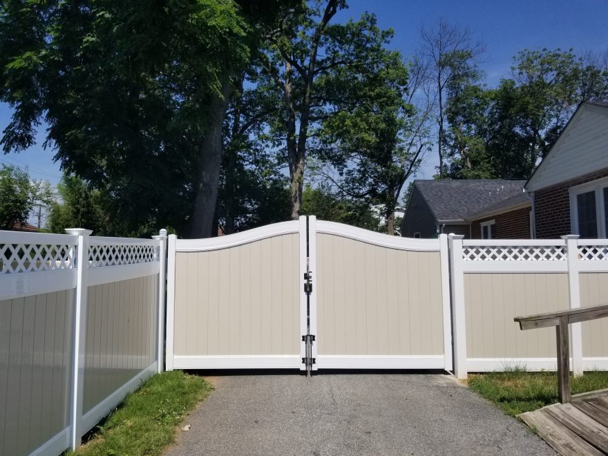 Tan and White Two Tone Vinyl Privacy Fence with Lattice Top and Arched Drive Gate