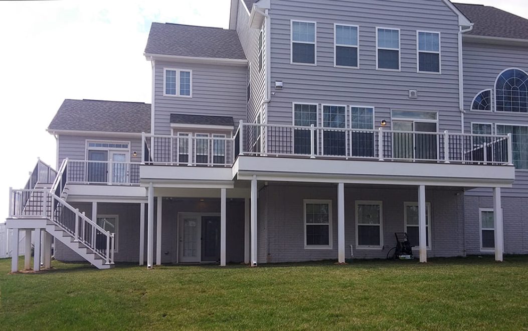 Trex Composite deck with white aluminum railing and black ballusters - wrapped beams and supports