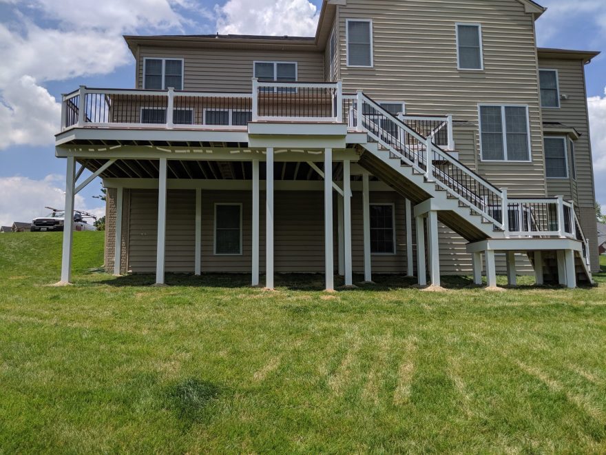 Trex Transcend Lava Rock Decking with White Washington Vinyl with Black Round Aluminum Balusters + White Vinyl Wrap around deck, beams and support posts