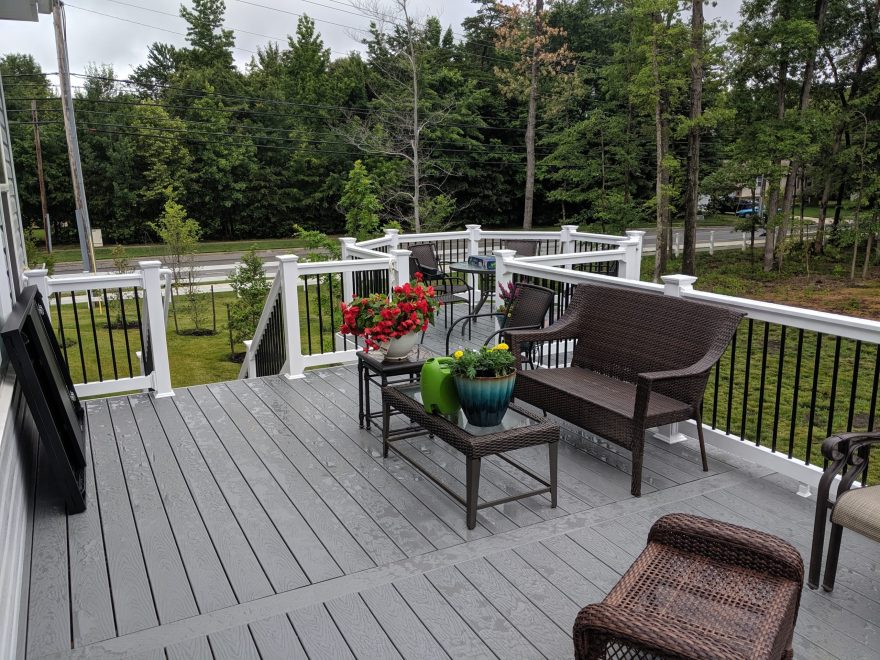 Trex Transcend Pebble Gray Decking with White Washington Vinyl Railing and Black Aluminum Balusters in Brandywine MD