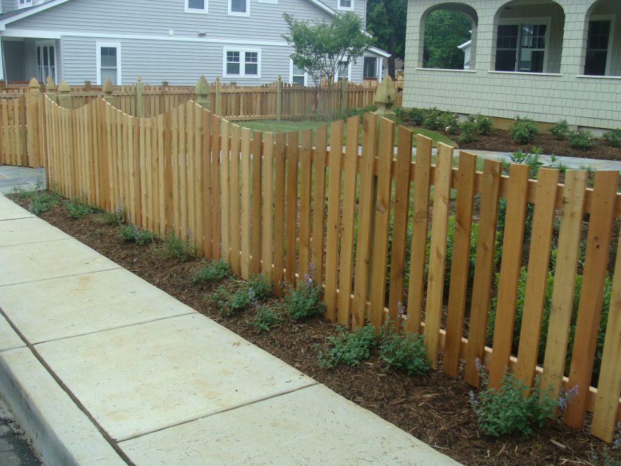 Wood Picket Fence with a Concave Dip and French Gothic Posts